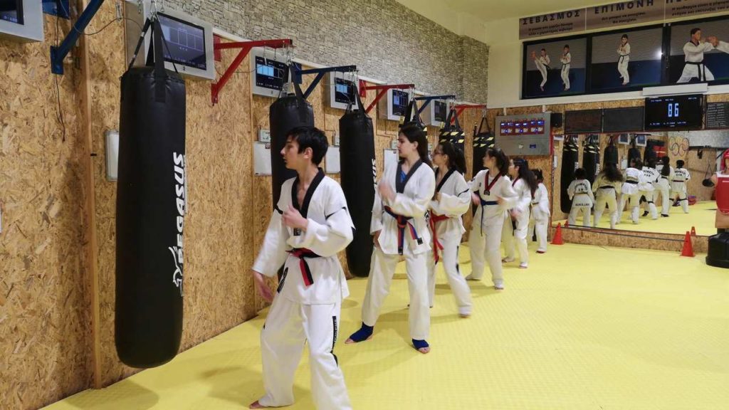 Taekwondo teens training to MFS bags